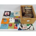 A collection of 7" vinyl records, various artists.