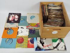 A collection of 7" vinyl records, various artists.