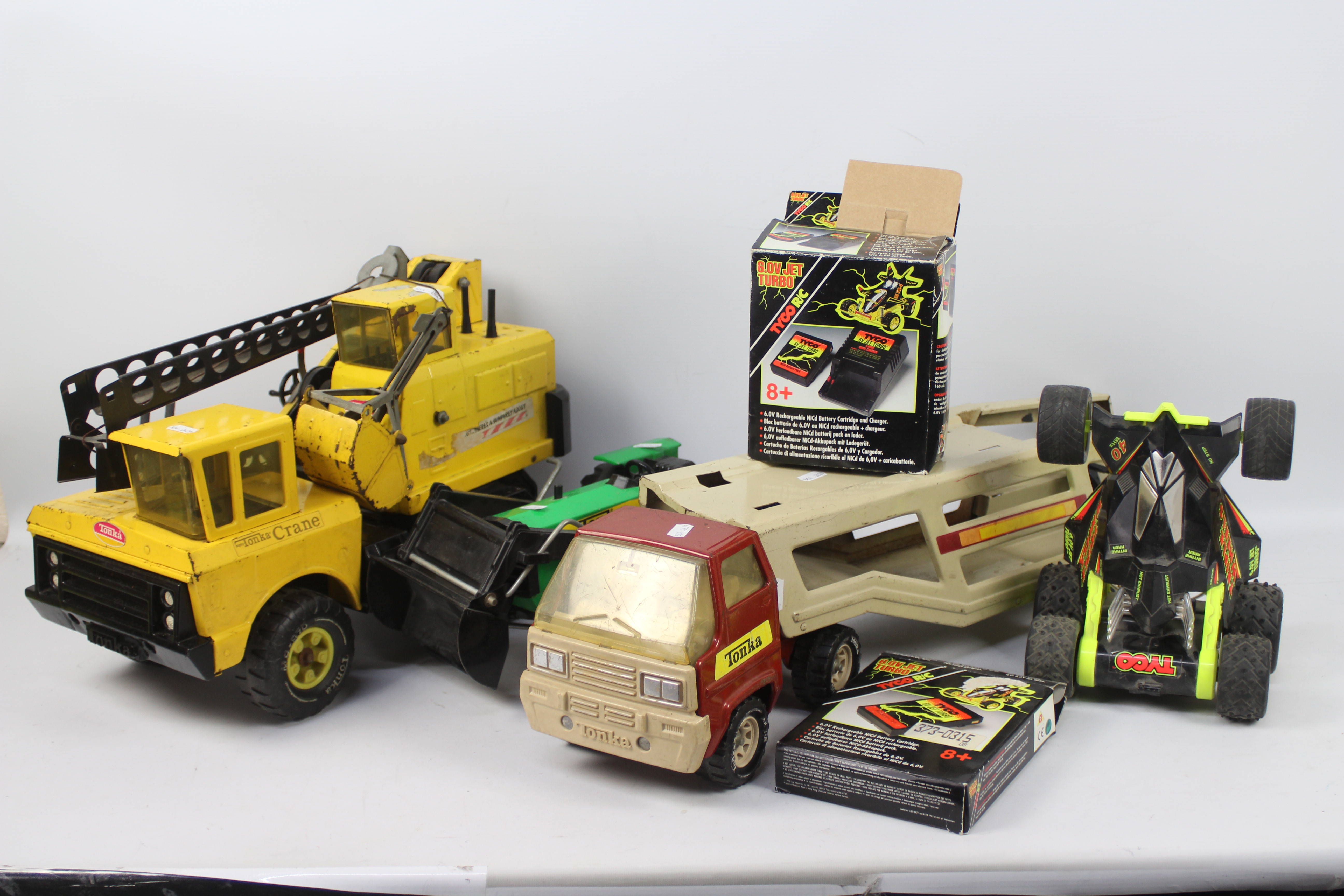 Tonka, Tyco - Three unboxed vintage Tonka vehicles including a John Deere Tracto,