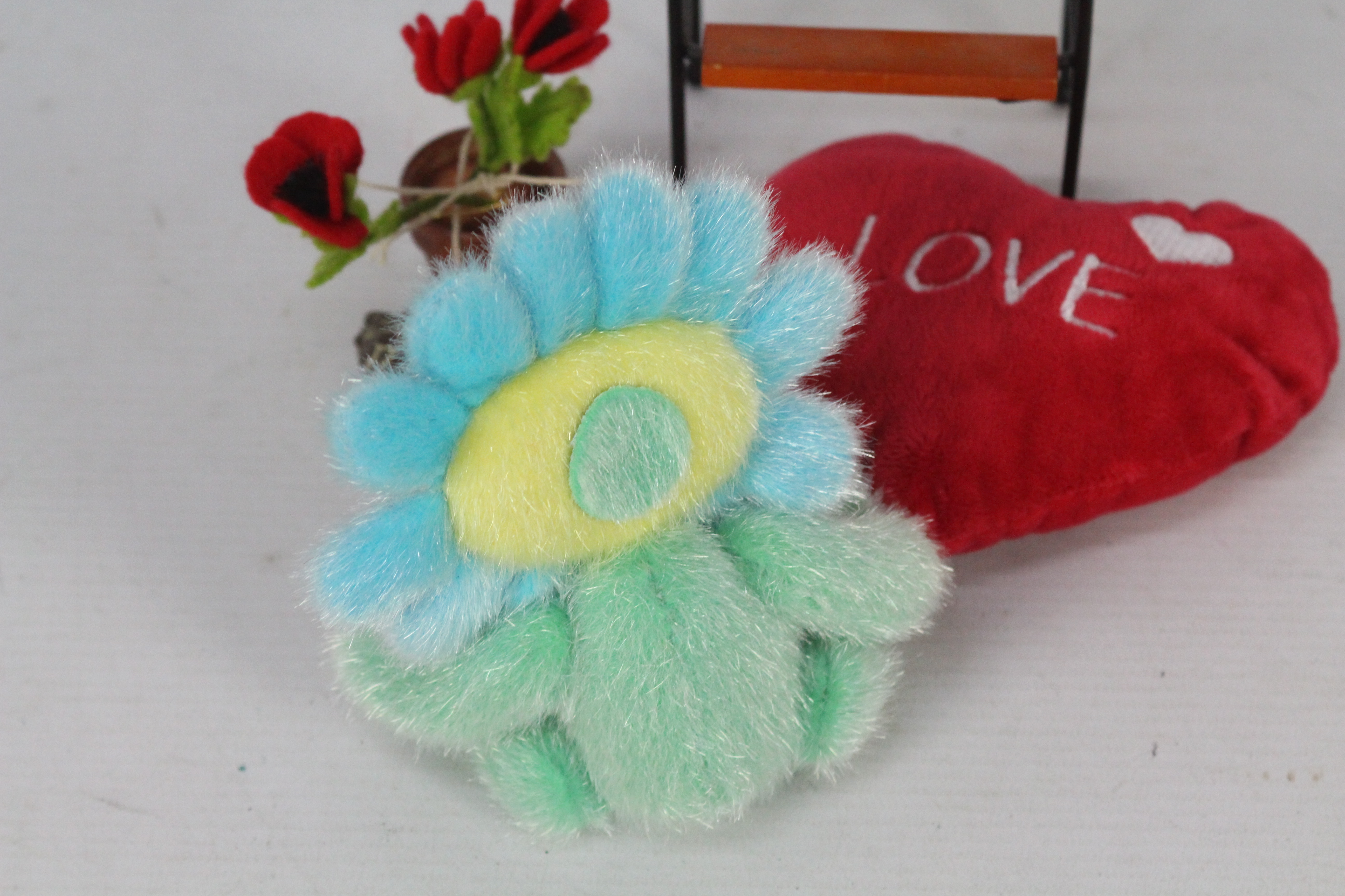 A soft toy in the form of a flower, soft toy has a red bow and a plastic lady bird accessory. - Image 4 of 4