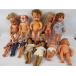 A collection of vintage dolls and action figures to include Tiny Tears, Action Man and similar.