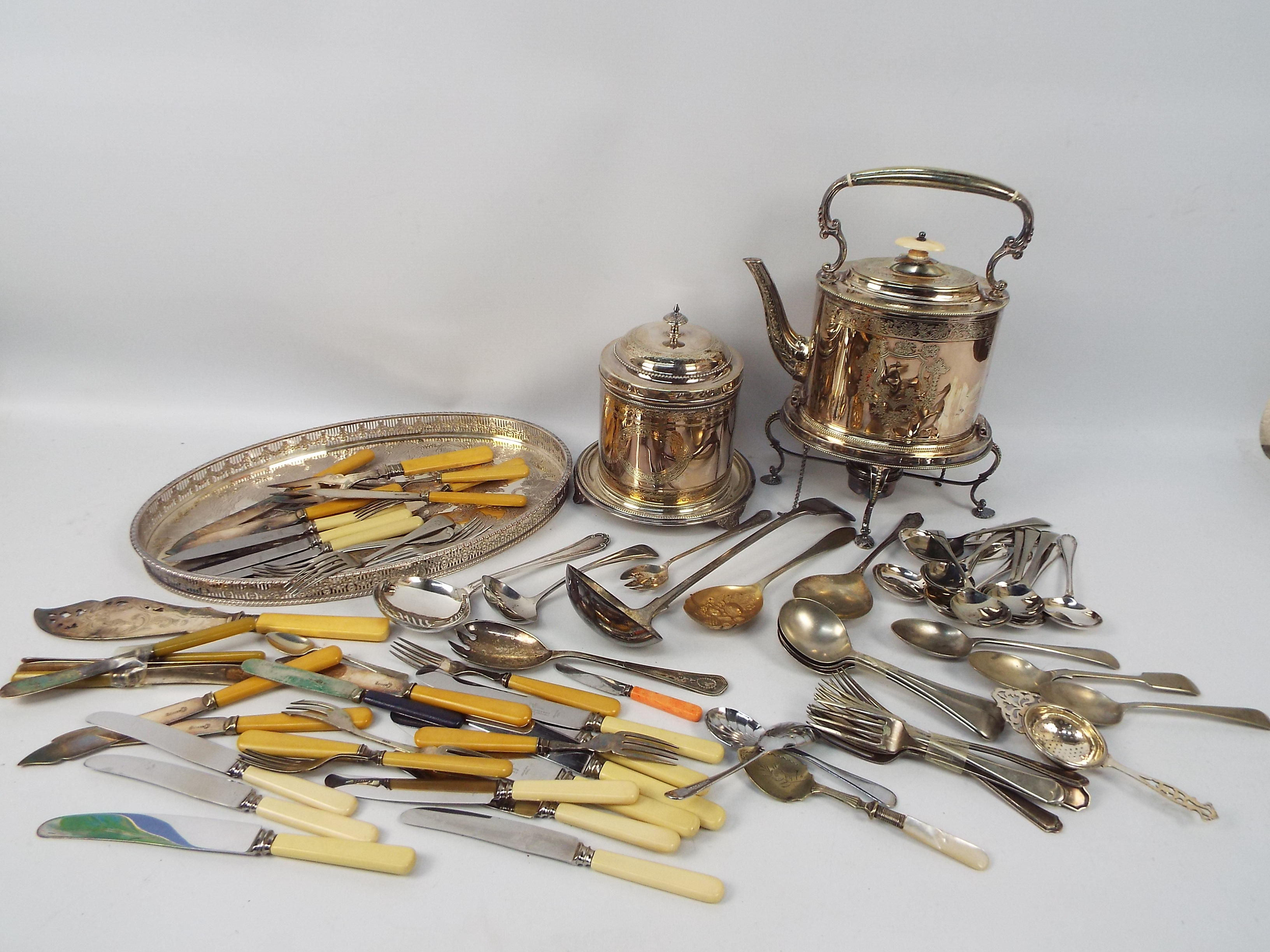 A quantity of plated ware to include spirit kettle and stand, tray,