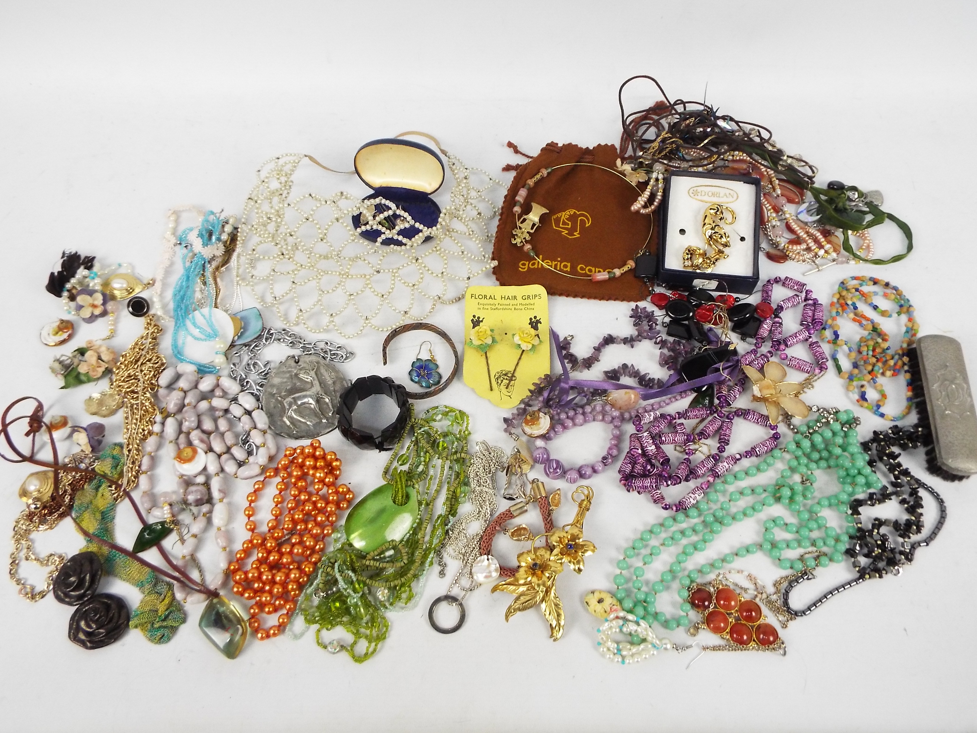 A collection of costume jewellery to include necklaces, bracelets, earrings, brooches and similar.