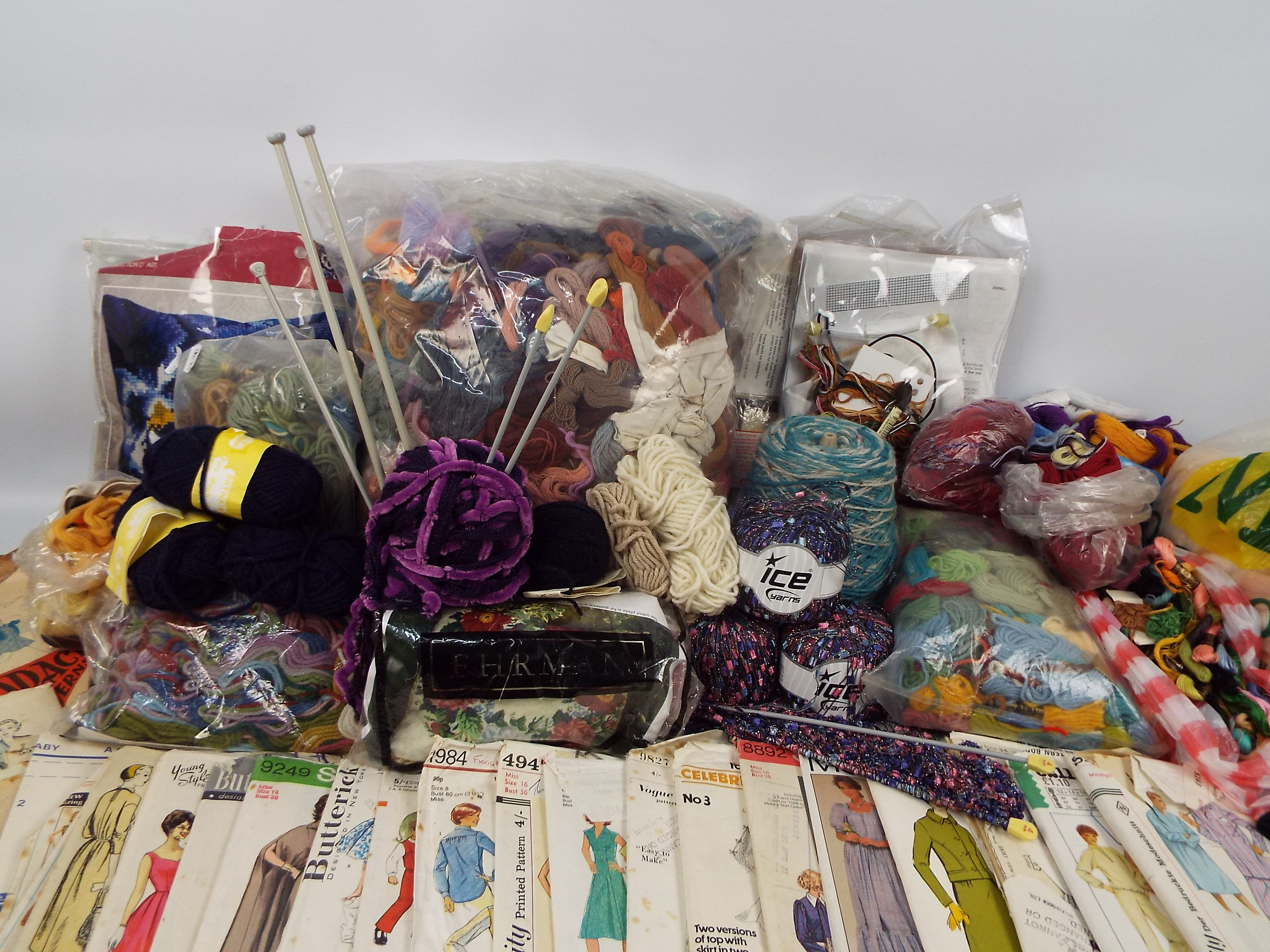 A collection of haberdashery items, sewing patterns and similar.