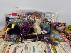 A collection of haberdashery items, sewing patterns and similar.
