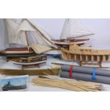 A collection of model boats and parts.