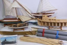 A collection of model boats and parts.