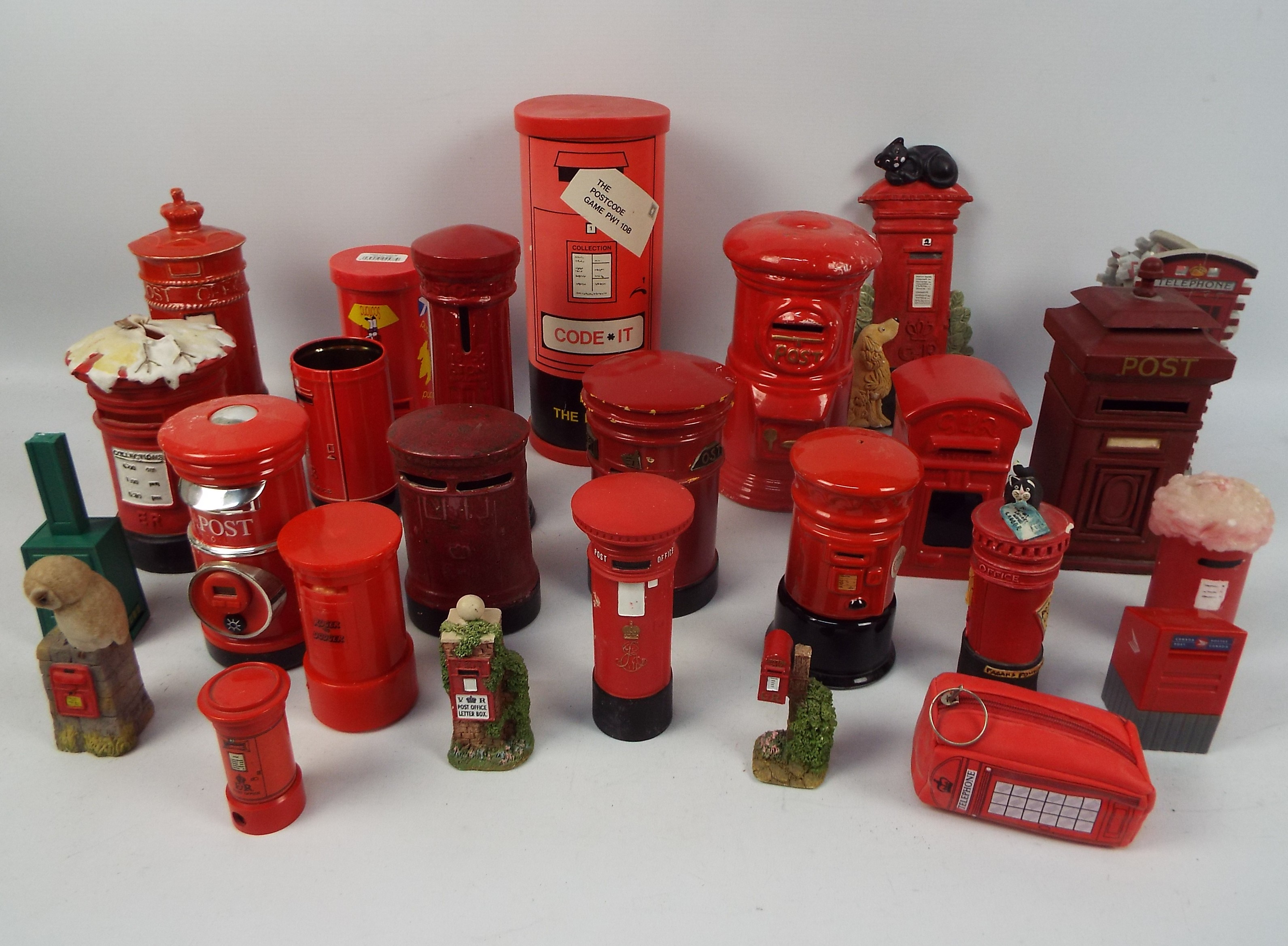 A collection of various Post Office pillar box models, money banks and similar.