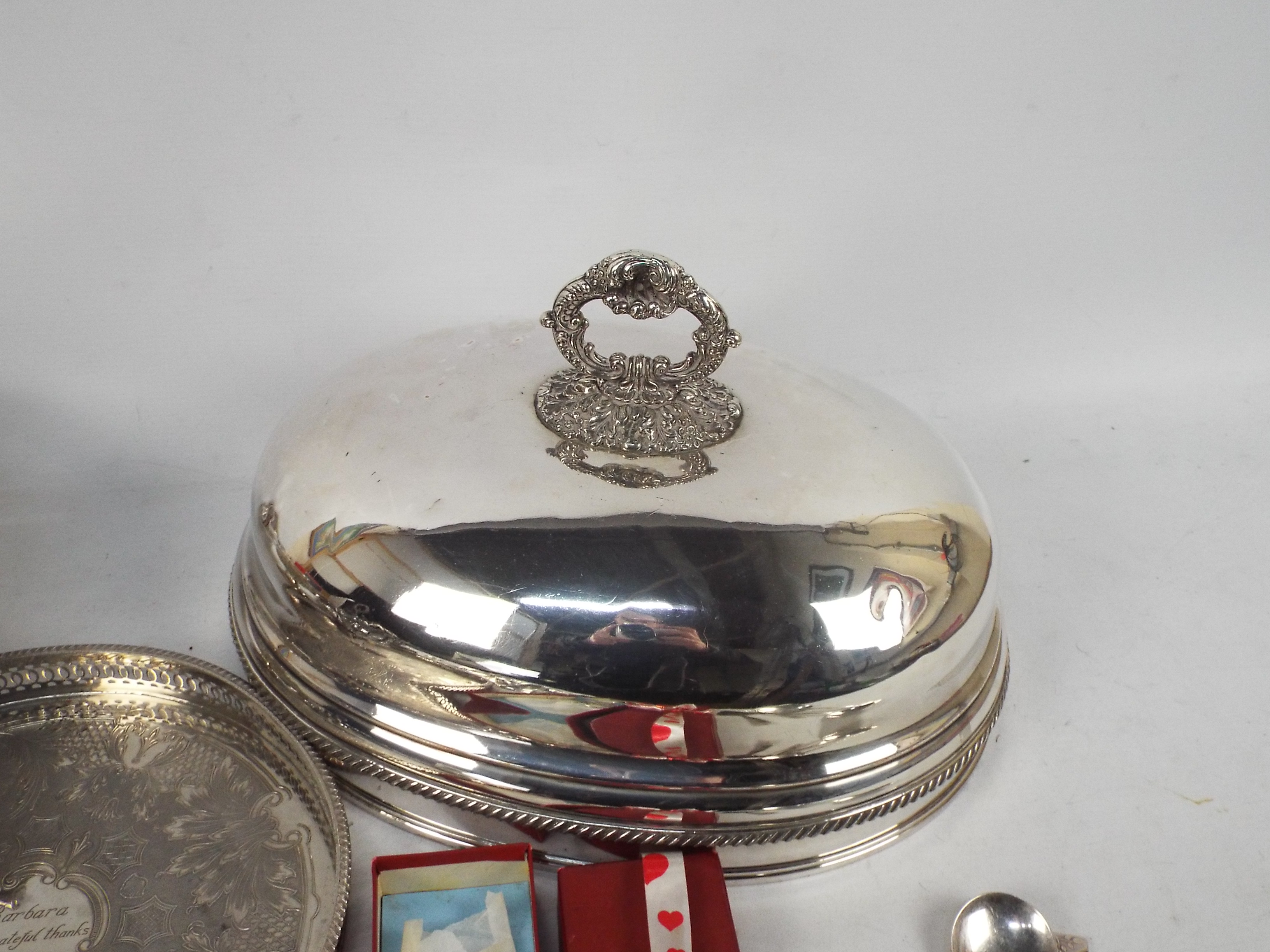 A collection of plated wares to include a cloche, tray, flatware and other. - Image 5 of 6