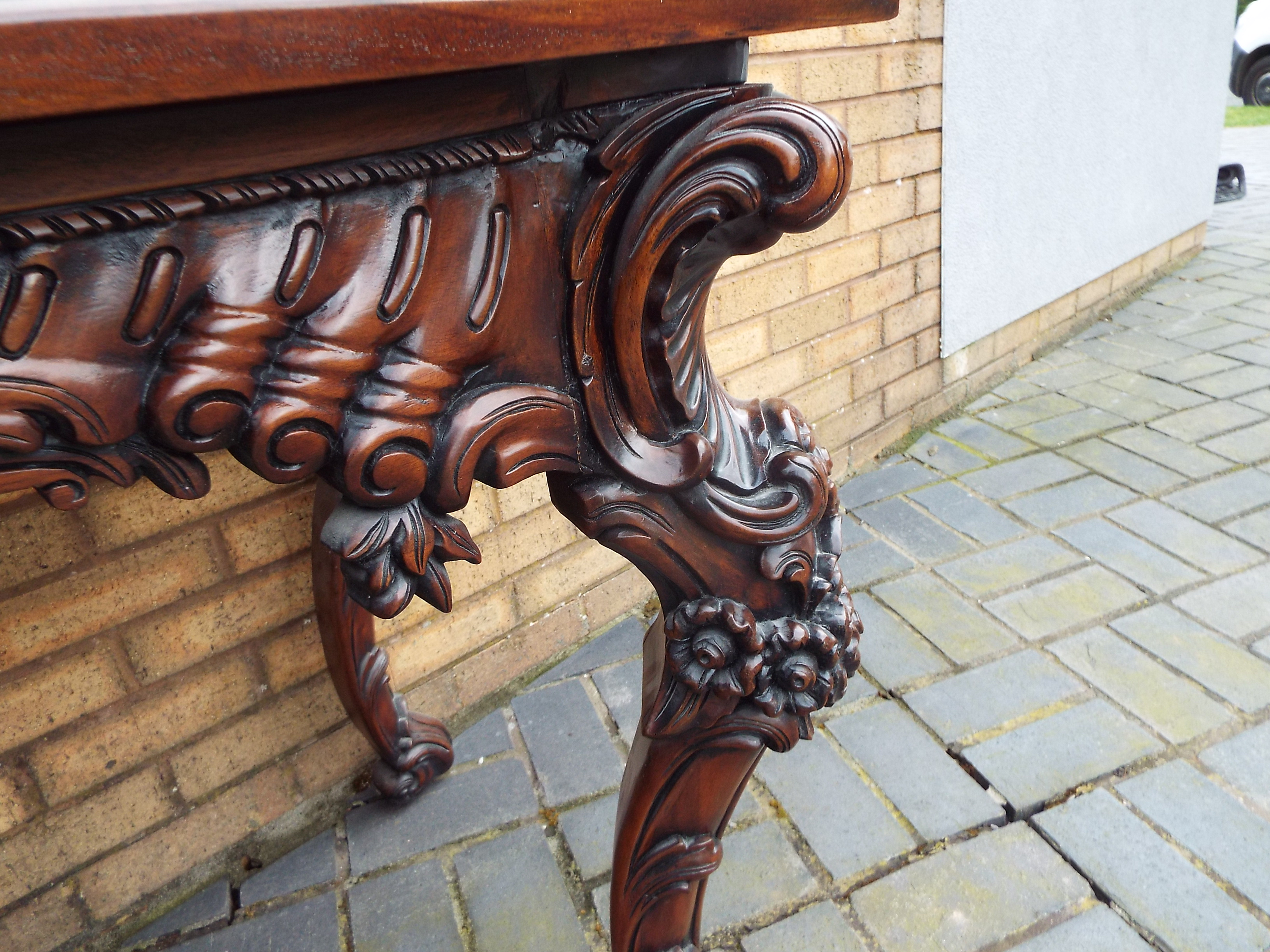 A side table profusely carved with floral and foliate motifs and central female mask, - Image 6 of 11