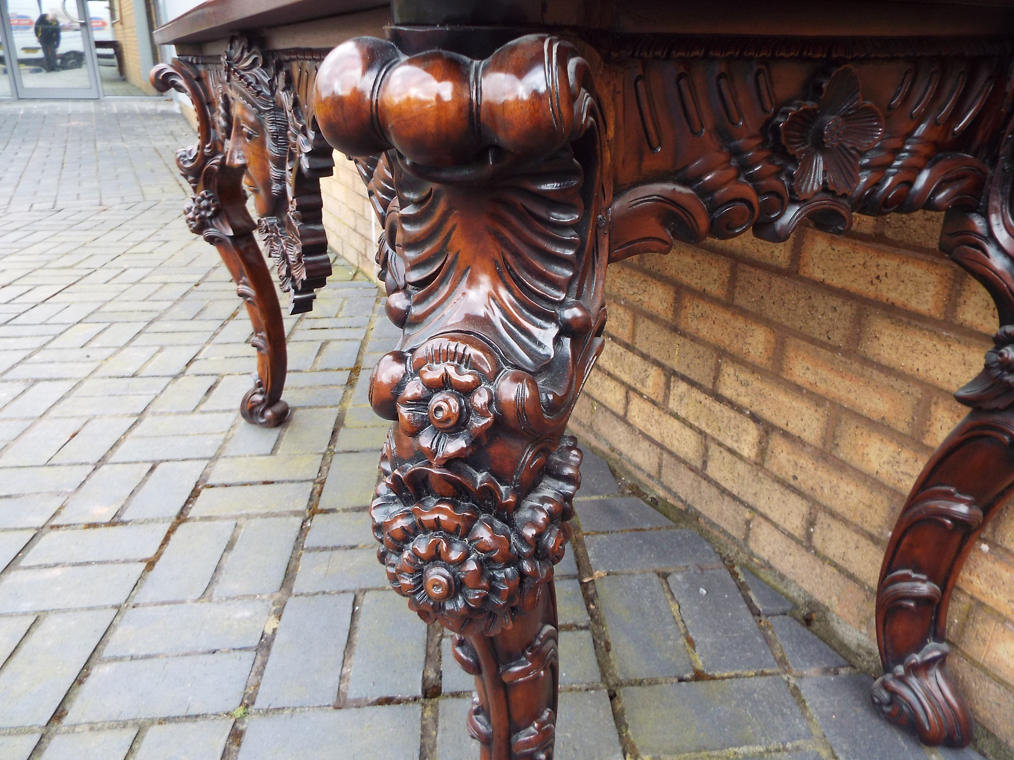 A side table profusely carved with floral and foliate motifs and central female mask, - Image 9 of 11