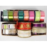 A varied collection of coloured ribbons, Kirkland Signature, APAC and similar for crafting,