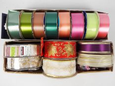 A varied collection of coloured ribbons, Kirkland Signature, APAC and similar for crafting,