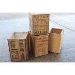 Four vintage metal bound, wooden tea chests, each approximately 60 cm x 50 cm x 40 cm.