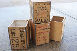 Four vintage metal bound, wooden tea chests, each approximately 60 cm x 50 cm x 40 cm.