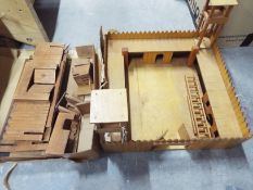 A wooden Fort Laramie playset and a furt