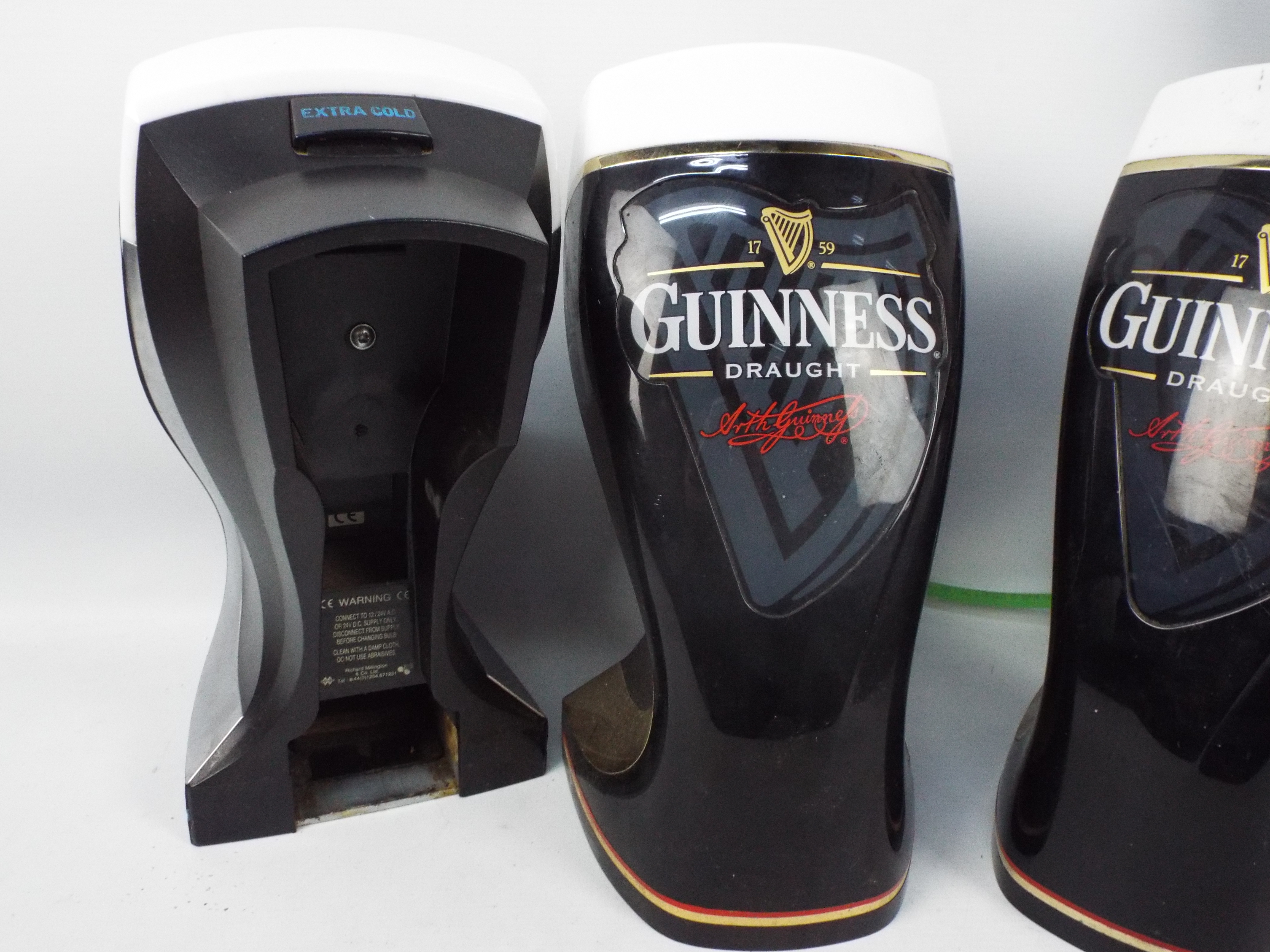 Guinness - Three Guinness bar top pump covers. - Image 2 of 4