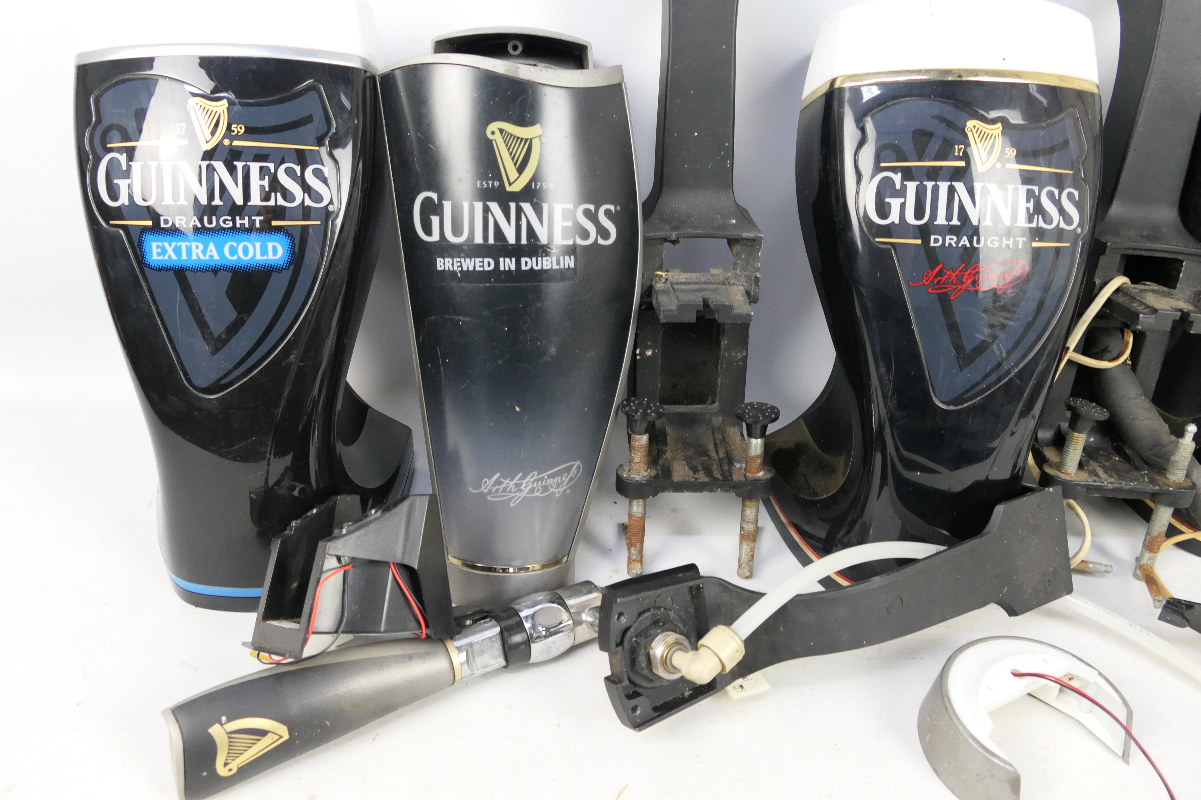 Guinness - Three Guinness bar top pump covers. - Image 3 of 4