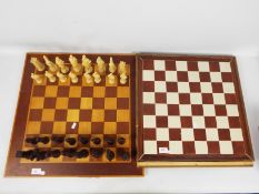 Two vintage chess boards and a set of chessmen with 10 cm (h) king.
