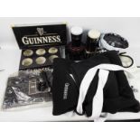 Guinness - Various Guinness branded collectables to include bar top covers, drip trays, inflatables,