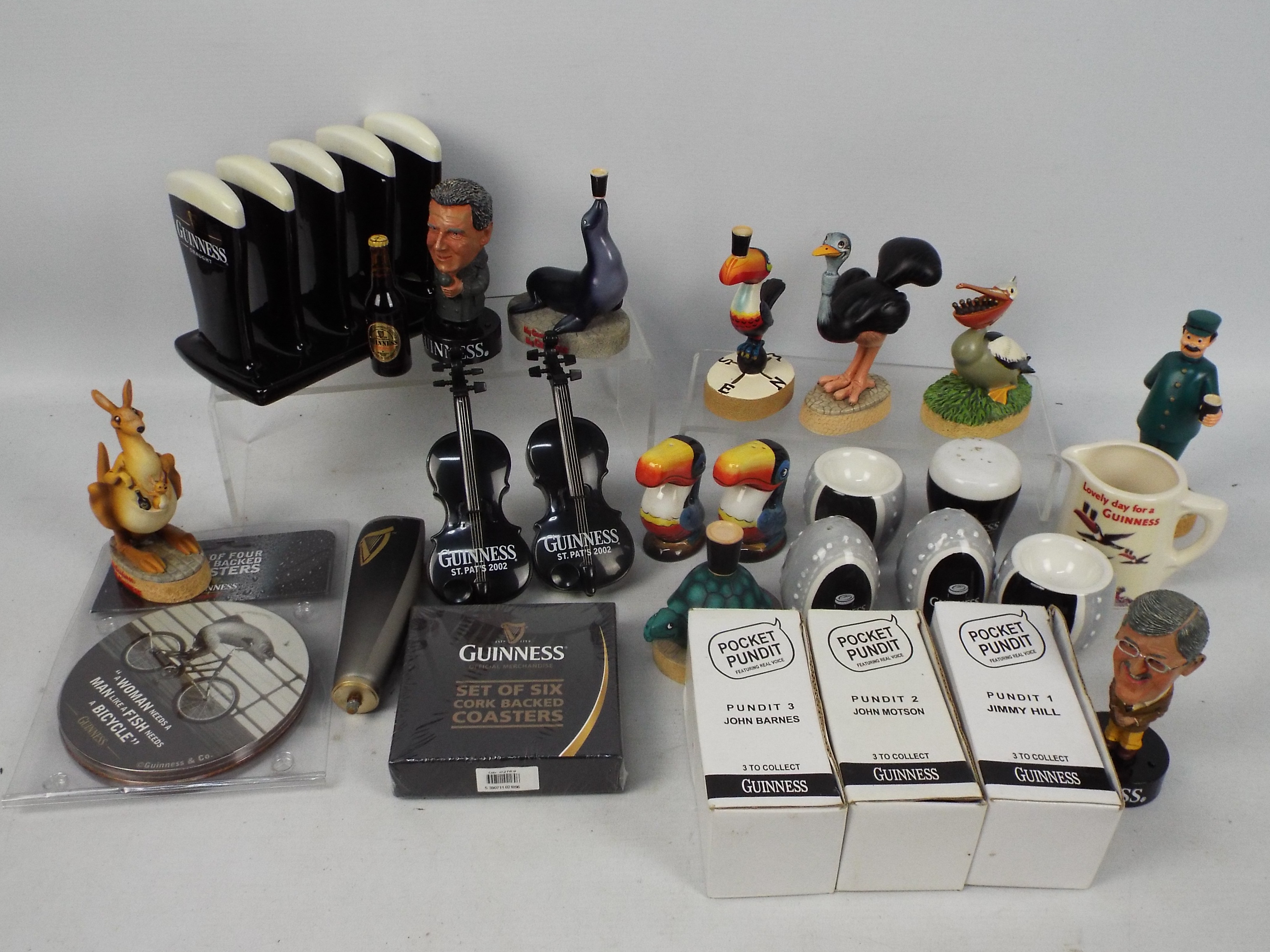 Guinness - A quantity of Guinness branded collectables to include cruet sets, egg cups, toast rack,