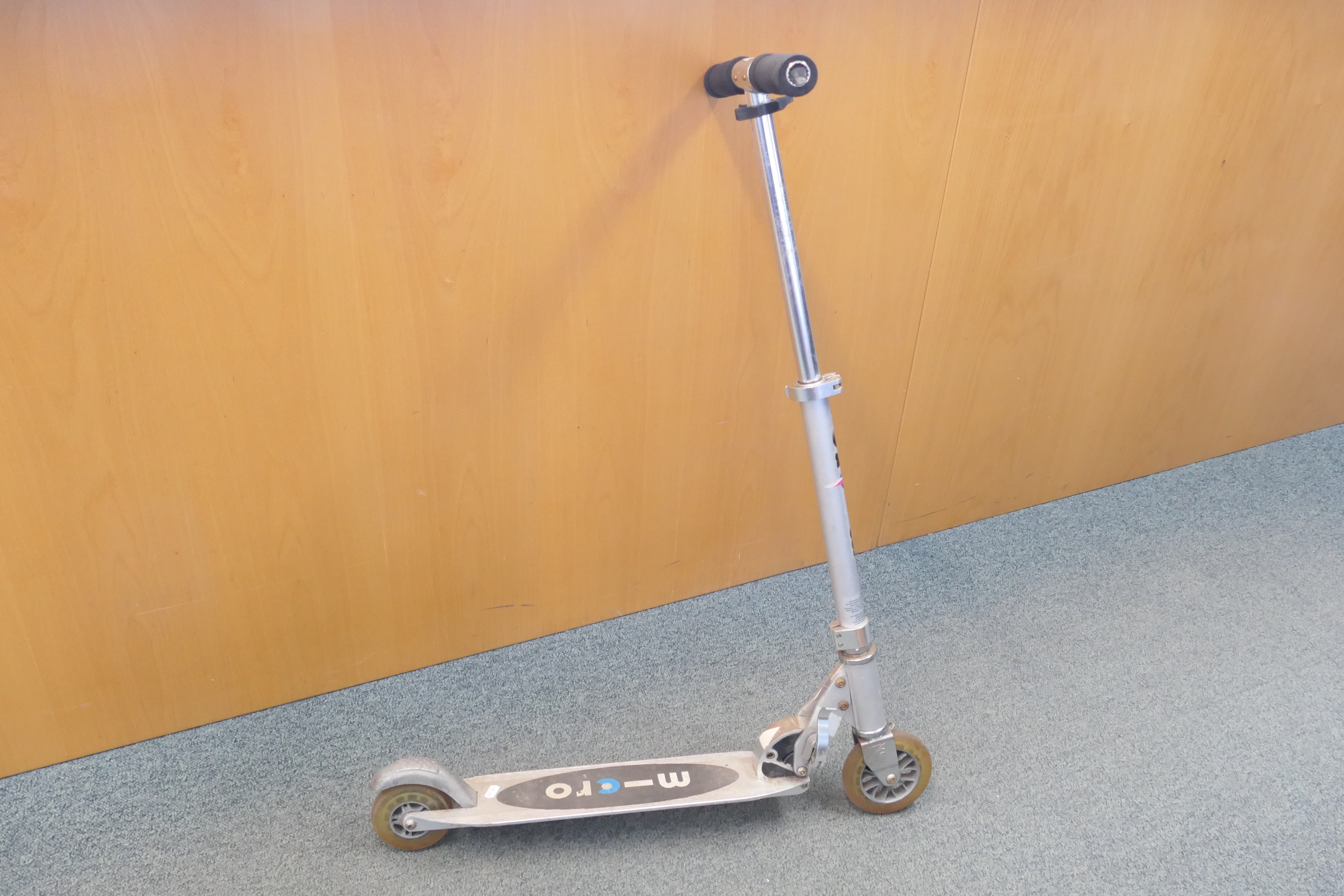 A folding micro scooter.