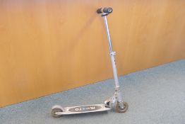 A folding micro scooter.