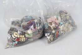 Two clear bags of unsorted costume jewel