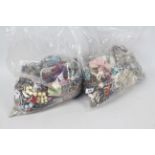 Two clear bags of unsorted costume jewel