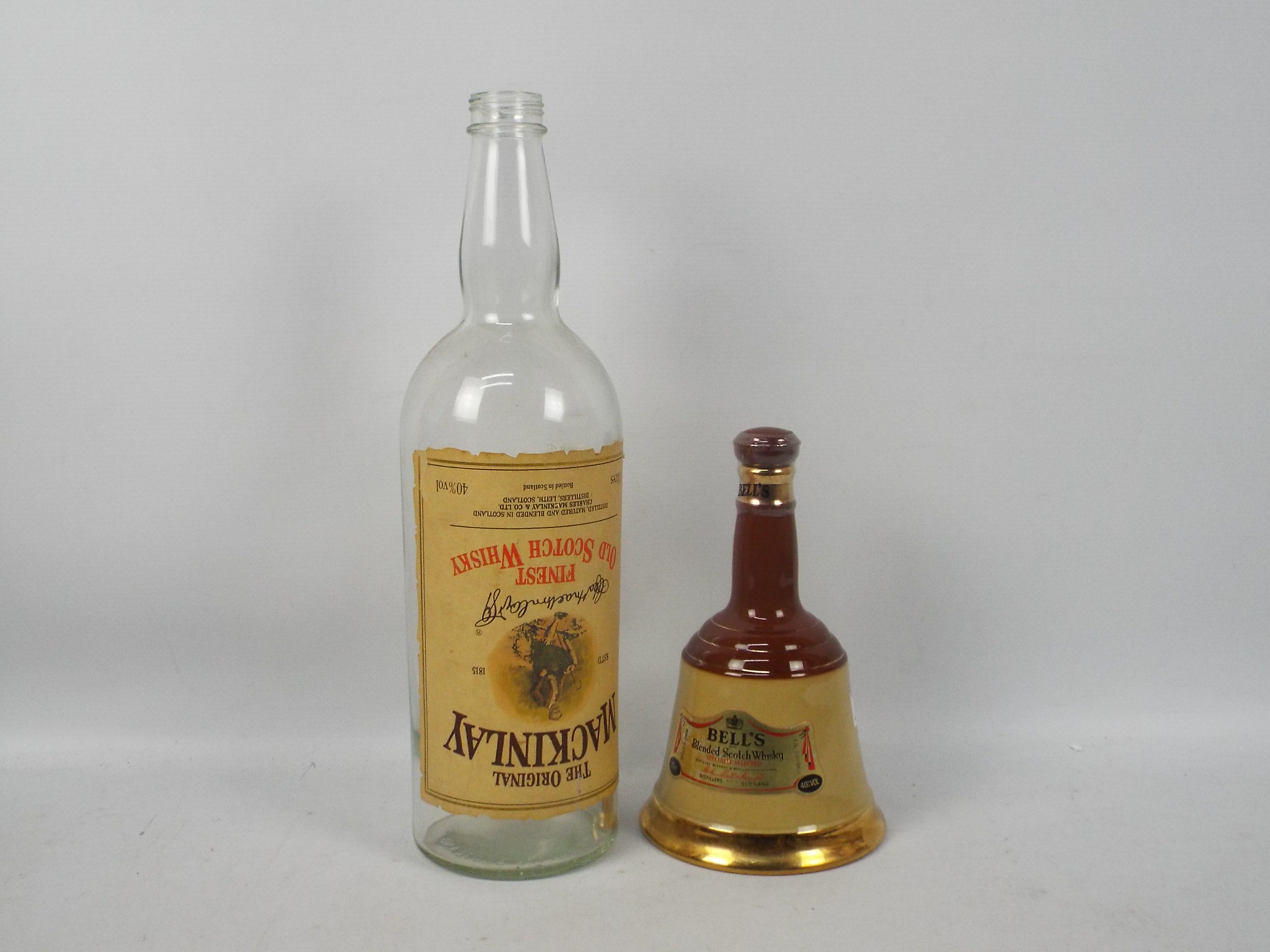 A Wade Bells whisky decanter with conten