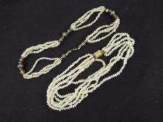Two multi-strand necklaces, one with gil