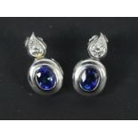 A pair of platinum, sapphire and diamond