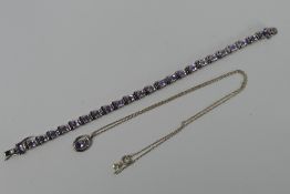 A silver and amethyst line bracelet with