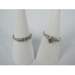 A white gold wedding set marked 14K comp