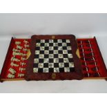 A Chinese style chess board and pieces w