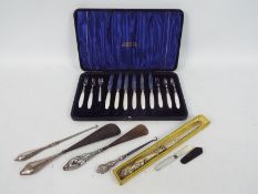 An Edwardian silver and mother of pearl flatware set in case, (one fork a plated replacement),
