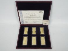 A limited edition, Windsor Mint, 24ct gold plated Pounds Ingots set,