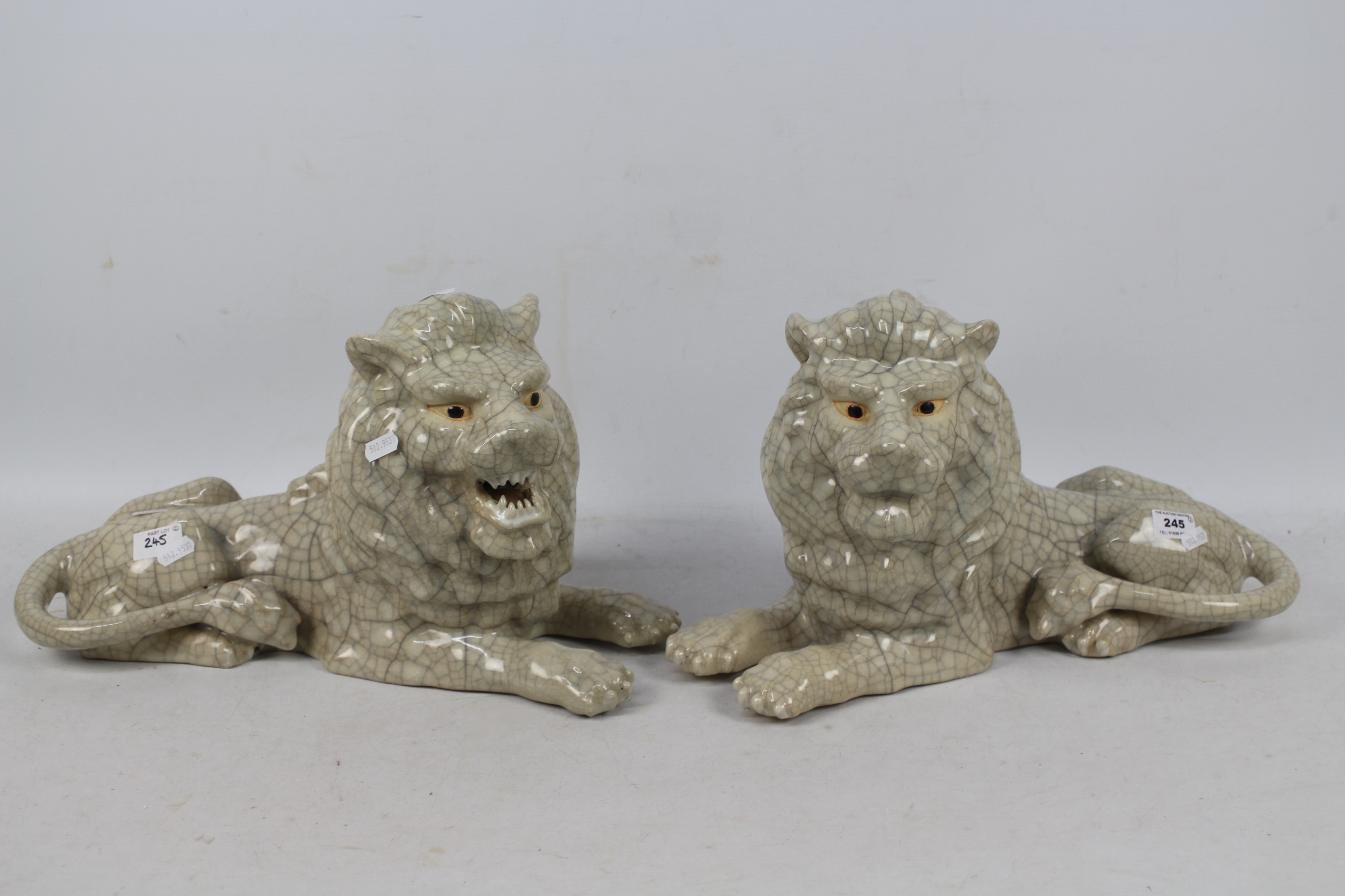 A large pair of crackle glaze lions, impressed seal mark to the base of one,