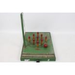 A vintage Amersham Games wooden table skittles game.