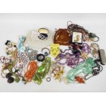 A collection of costume jewellery to include necklaces, bracelets, earrings, brooches and similar.