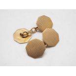 A pair of 9ct gold cufflinks of octagonal form with engine turned decoration, 5 grams.