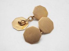 A pair of 9ct gold cufflinks of octagonal form with engine turned decoration, 5 grams.