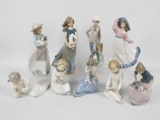 Nao - Nine various Nao figures to include girls with animals, children and other,