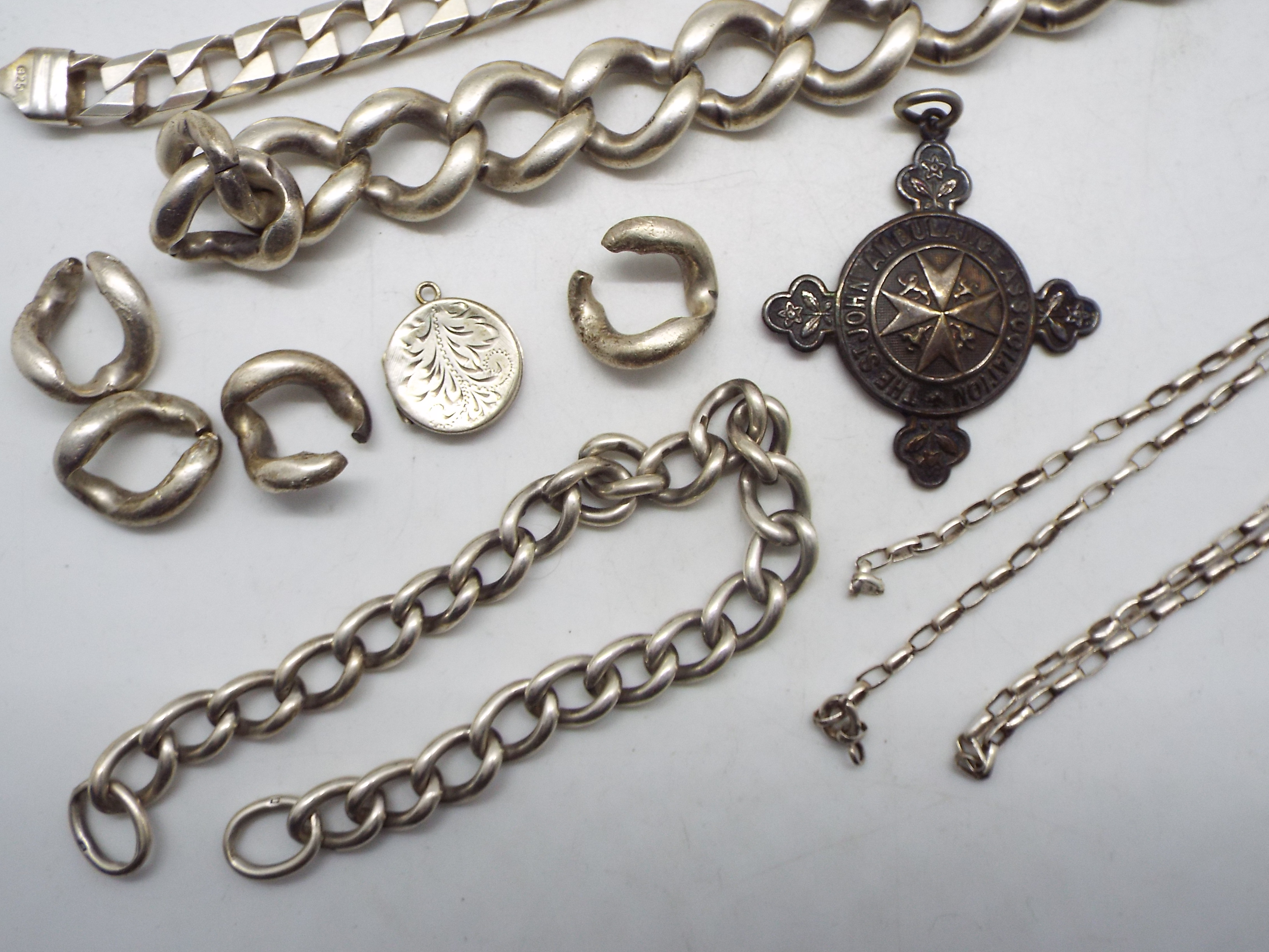 A collection of silver and white metal jewellery to include bracelets (A/F), locket pendant, - Image 2 of 5