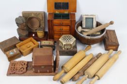 A collection of treen to include trinket boxes, rolling pins, carving and similar.