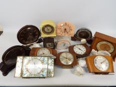 A collection of electric clocks to include Metamec, Smiths and similar.