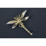 A 9ct gold brooch in the form of a dragonfly, 4.5 cm (l), approximately 3.2 grams.