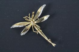A 9ct gold brooch in the form of a dragonfly, 4.5 cm (l), approximately 3.2 grams.