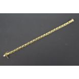 An 18ct yellow gold bracelet with twin safety catch, 22 cm (l), approximately 34.