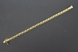 An 18ct yellow gold bracelet with twin safety catch, 22 cm (l), approximately 34.